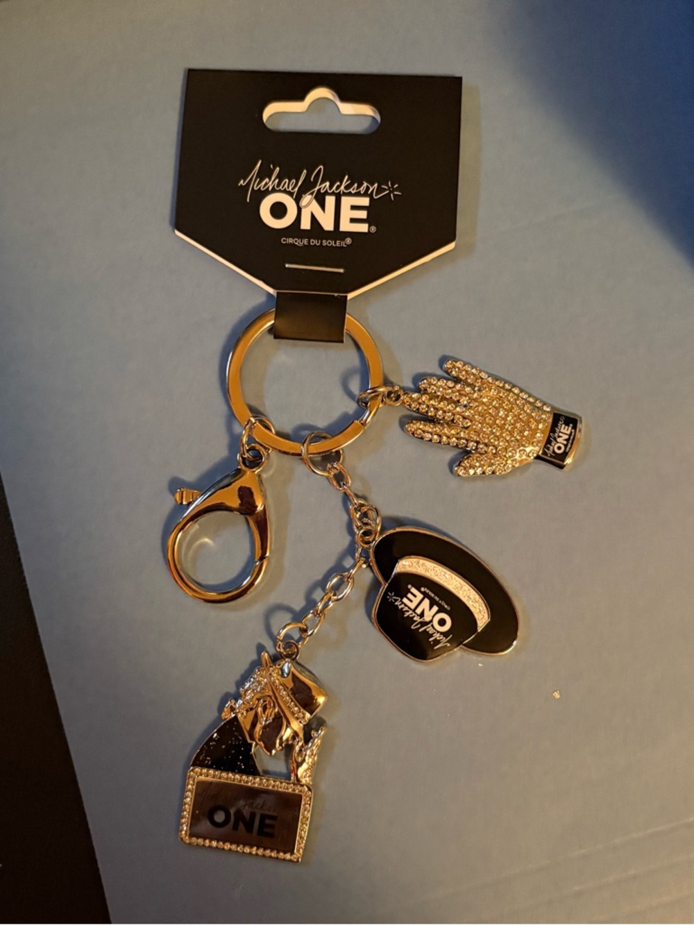 Official Michael Jackson ONE by Cirque du Soleil charm keychain.